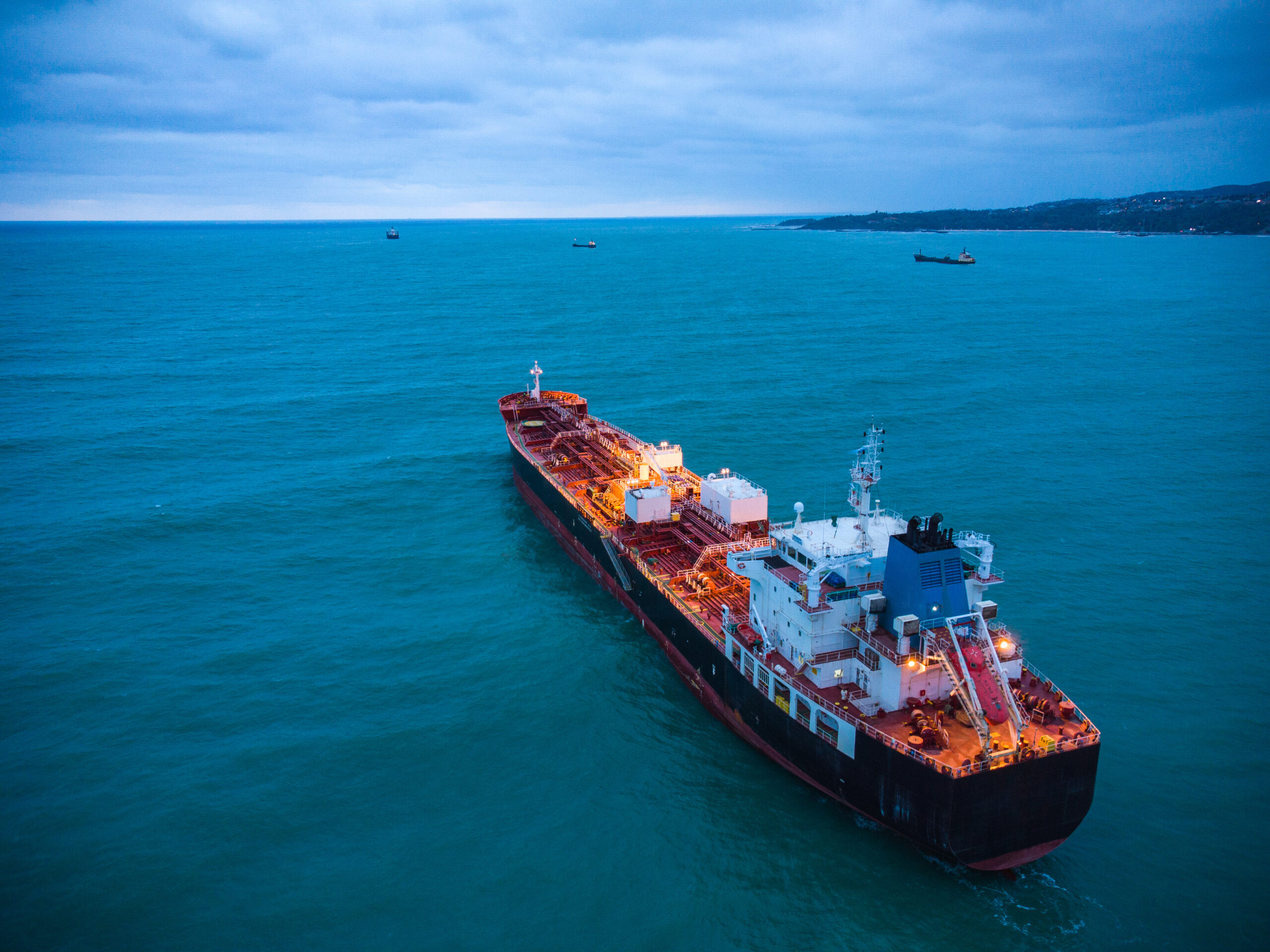 Aerial top view oil ship tanker carrier oil on the sea at sunrise