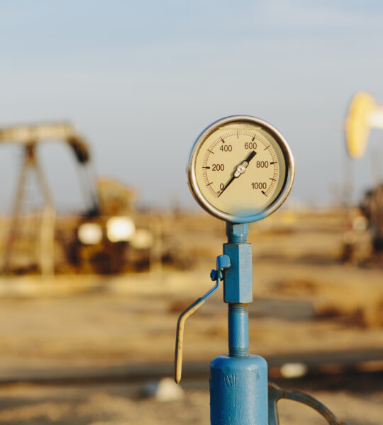 Air pressure gauge, oil rigs in background, Sunset-Midway oil fields, the largest in California.